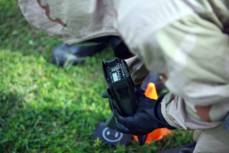 A technician evaluates the radiation levels during an exercise.