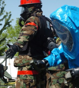 A technician scans for radiation in this image.